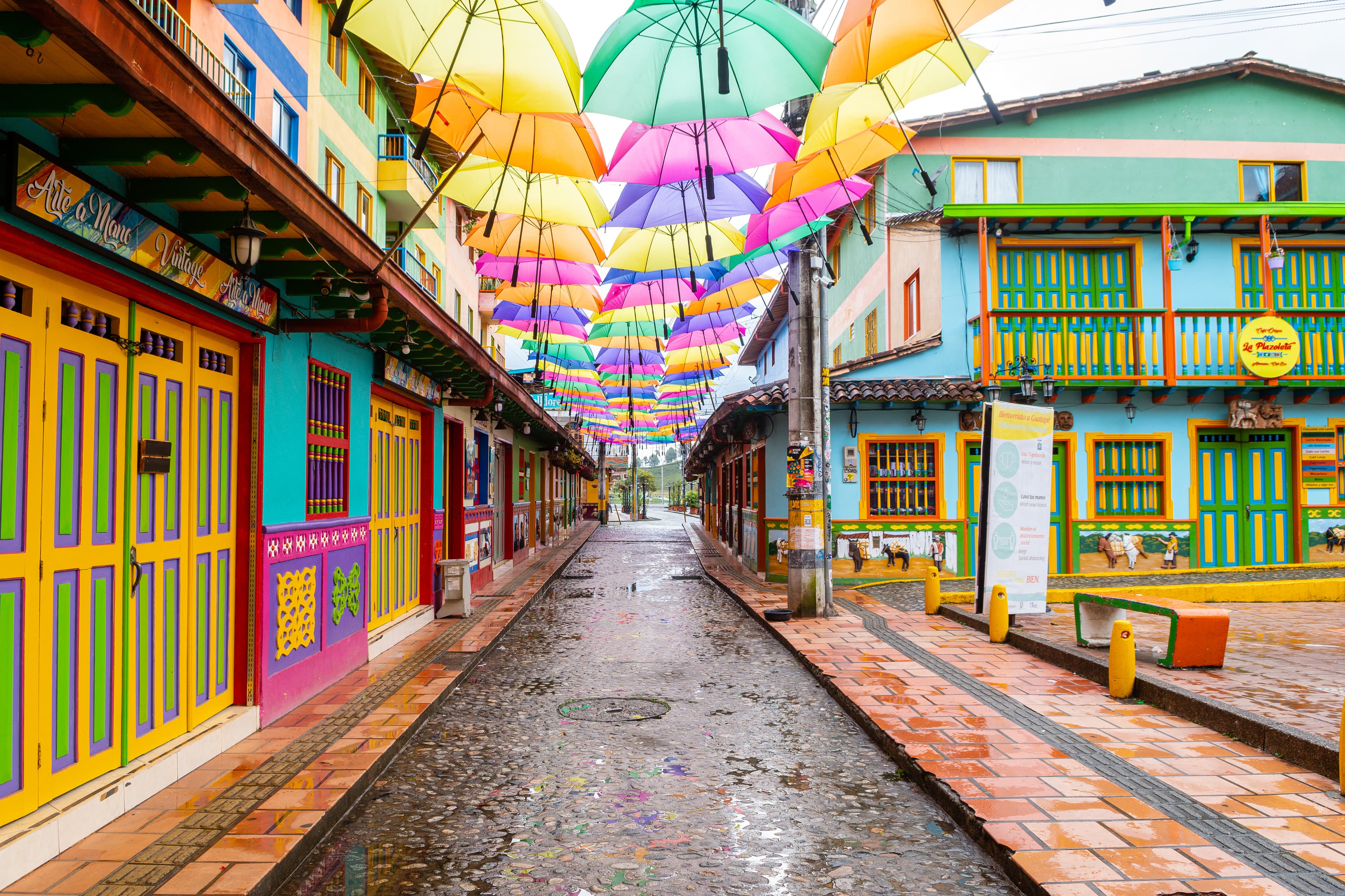 Colourful street with rainbow umbrellas in Guatapé